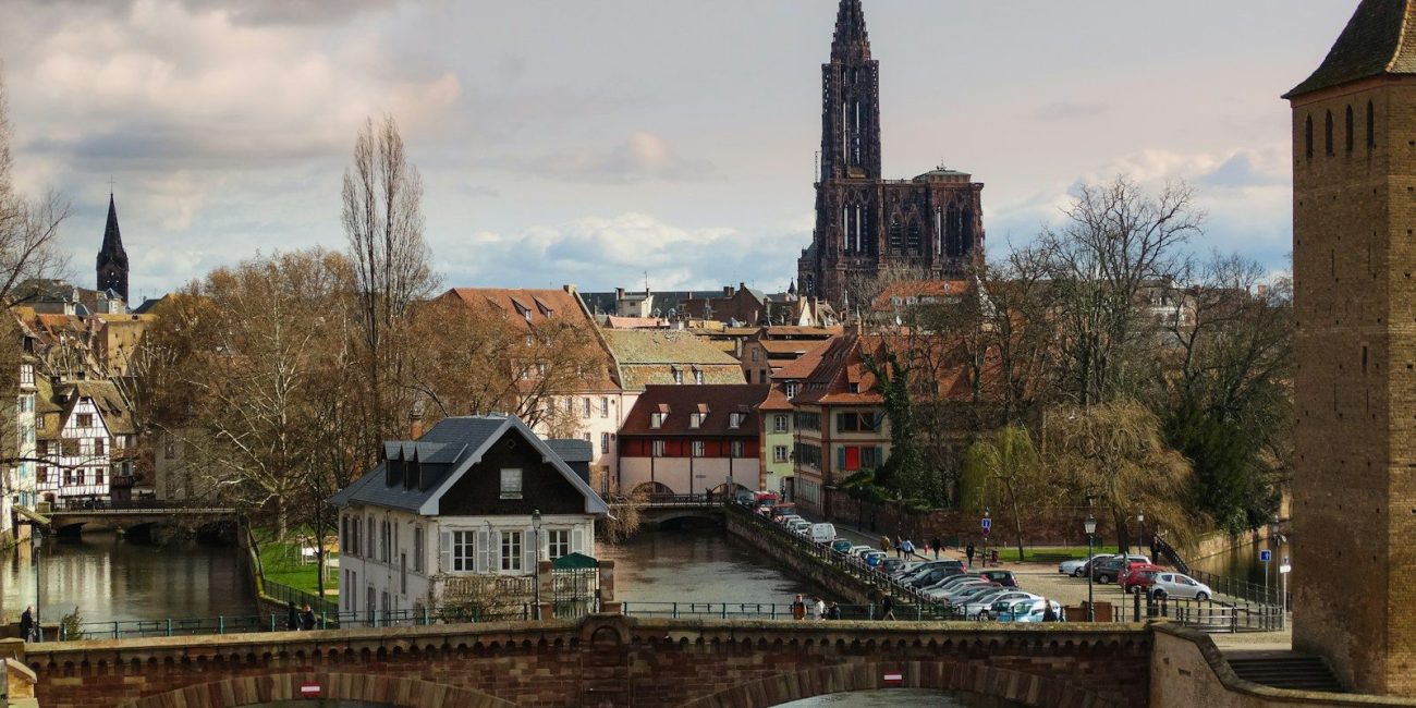 A scenic european town with a tall cathedral.