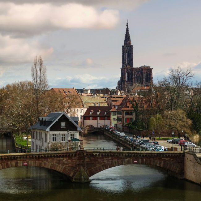 A scenic european town with a tall cathedral.